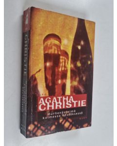 Kirjailijan Agatha Christie käytetty kirja Murhenäytelmä kolmessa näytöksessä