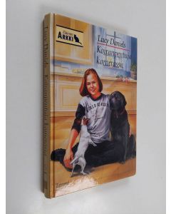Kirjailijan Lucy Daniels käytetty kirja Koiranpentuja komerossa