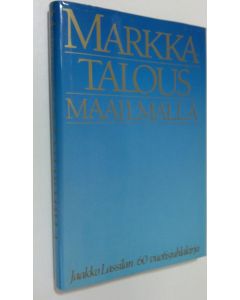 Kirjailijan Klaus Waris ym. käytetty kirja Markkatalous maailmalla : tohtori Jaakko Lassilan 60-vuotisjuhlakirja