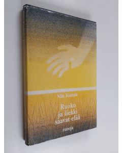 Kirjailijan Niilo Rauhala käytetty kirja Ruoko ja liekki saavat elää : runoja
