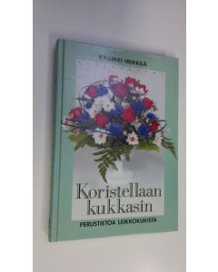 Kirjailijan Kyllikki Heikkilä käytetty kirja Koristellaan kukkasin