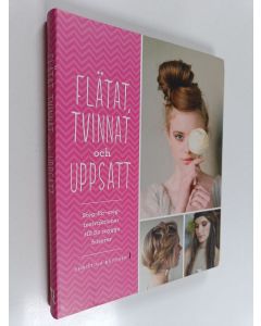 Kirjailijan Christina Butcher käytetty kirja Flätat, tvinnat och uppsatt steg-för-steg-instruktioner till 82 snygga frisyrer