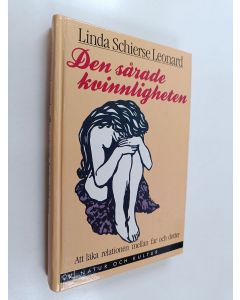 Kirjailijan Linda Schierse Leonard käytetty kirja Den sårade kvinnligheten