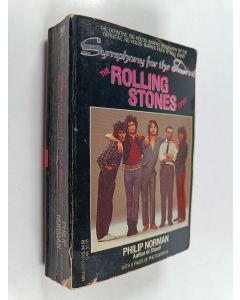 Kirjailijan Philip Norman käytetty kirja Symphony for the devil : the Rolling Stones story