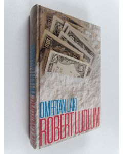 Kirjailijan Robert Ludlum käytetty kirja Omertan laki
