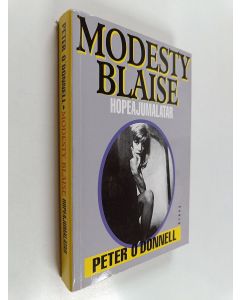 Kirjailijan Peter O'Donnell käytetty kirja Modesty Blaise, hopeajumalatar