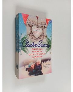 Kirjailijan Claire Sandy käytetty kirja Snöfall, mirakel och frusna hjärtan