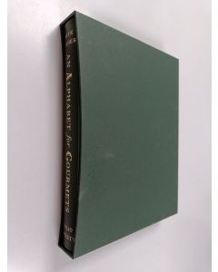 Kirjailijan M. F. K. Fisher käytetty kirja An Alphabet for Gourmets (Laatikossa)