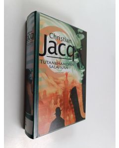 Kirjailijan Christian Jacq käytetty kirja Tutankhamonin salaisuus