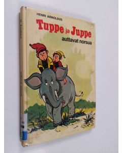 Kirjailijan Henri Arnoldus käytetty kirja Tuppe ja Juppe auttavat norsua