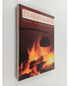 Kirjailijan Honkain käytetty kirja Honkain keskellä : seura- ja erälaulukirja