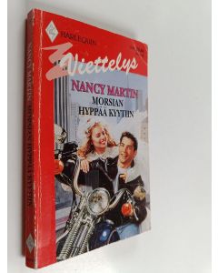 Kirjailijan Nancy Martin käytetty kirja Morsian hyppää kyytiin