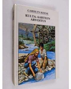 Kirjailijan Carolyn Keene käytetty kirja Kulta-aarteen arvoitus