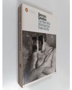 Kirjailijan Georges Simenon käytetty kirja The man who watched the trains go by