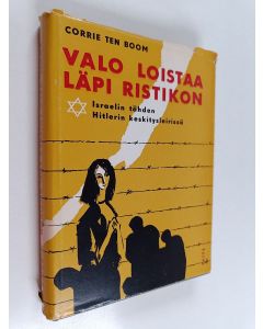 Kirjailijan Corrie ten Boom käytetty kirja Valo loistaa läpi ristikon