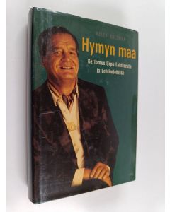 Kirjailijan Kalevi Kalemaa käytetty kirja Hymyn maa : kertomus Urpo Lahtisesta ja Lehtimiehistä