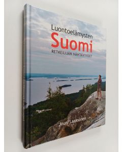 Kirjailijan Jouni Laaksonen käytetty kirja Luontoelämysten Suomi : retkeilijän nähtävyydet