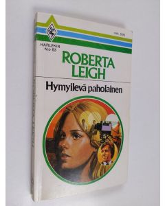 Kirjailijan Roberta Leigh käytetty kirja Hymyilevä paholainen