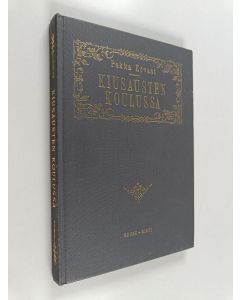 Kirjailijan Pekka Ervast käytetty kirja Kiusausten koulussa : Helsingin esitelmiä syksyllä 1927