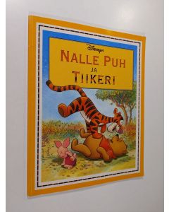 Kirjailijan Walt Disney käytetty kirja Nalle puh ja Tiikeri