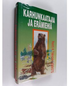 Kirjailijan Pentti H. Tikkanen käytetty kirja Karhunkaatajia ja erämiehiä
