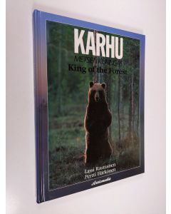 Kirjailijan Lassi Rautiainen käytetty kirja Karhu, metsien kuningas = King of the forest