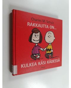 Kirjailijan Charles M Schulz käytetty kirja Rakkautta on... kulkea käsi kädessä