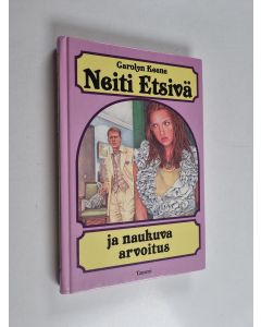 Kirjailijan Carolyn Keene käytetty kirja Neiti Etsivä ja naukuva arvoitus