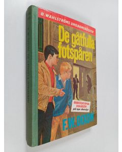 Kirjailijan Franklin W. Dixon käytetty kirja De gåtfulla fotspåren
