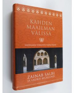 Kirjailijan Jaana Ryynänen & Zainab Salbi ym. käytetty kirja Kahden maailman välissä - Saddamin varjosta vapauteen (ERINOMAINEN)