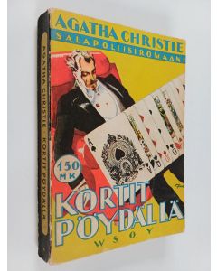 Kirjailijan Agatha Christie käytetty kirja Kortit pöydällä