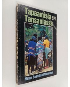 Kirjailijan Minna Saarelma-Maunumaa käytetty kirja Tapaamisia Tansaniassa