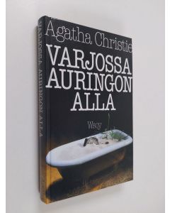 Kirjailijan Agatha Christie käytetty kirja Varjossa auringon alla