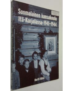 Kirjailijan Martti Hölsä käytetty kirja Suomalainen kansakoulu Itä-Karjalassa 1941-1944 (signeerattu) : Itä-Karjalan sotilashallintoesikunnan kansakoululaitos