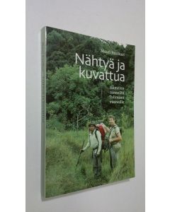 Kirjailijan Mauri Rautkari käytetty kirja Nähtyä ja kuvattua : Jäämeren rannoilta Tulimaan vuonoihin