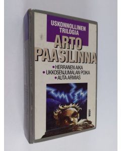 Kirjailijan Arto Paasilinna käytetty kirja Uskonnollinen trilogia : Herranen aika ; Ukkosenjumalan poika ; Auta armias