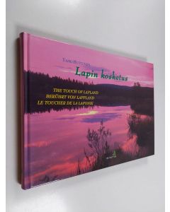Kirjailijan Tapio Huttunen käytetty kirja Lapin kosketus = The touch of Lapland = Berührt von Lappland = Le toucher de la Laponie