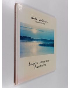 Kirjailijan Heikki Kokkonen käytetty kirja Luojan suuruutta ihmettelen : luontokuvia