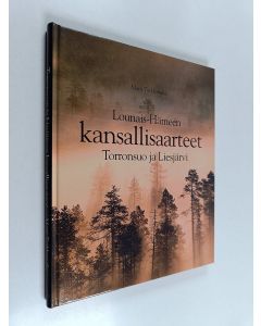 Kirjailijan Matti Torkkomäki käytetty kirja Lounais-Hämeen kansallisaarteet : Torronsuo ja Liesjärvi