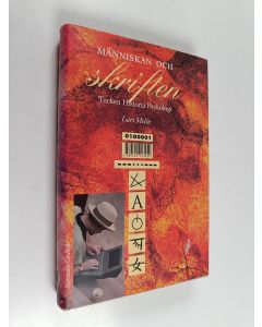 Kirjailijan Lars Melin käytetty kirja Människan och skriften : Tecken, historia, psykologi