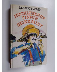 Kirjailijan Mark Twain käytetty kirja Huckleberry Finnin seikkailut