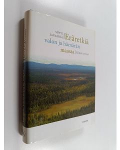 Kirjailijan Seppo Saraspää käytetty kirja Eräretkiä valon ja hämärän maassa : valitut tarinat