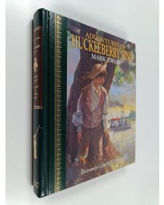 Kirjailijan Mark Twain käytetty kirja The Adventures of Huckleberry Finn