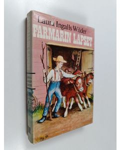 Kirjailijan Laura Ingalls Wilder käytetty kirja Farmarin lapset