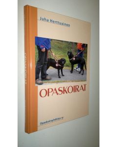 Kirjailijan Juha Herttuainen käytetty kirja Opaskoirat