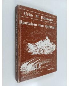 Kirjailijan Urho Heinonen käytetty kirja Rautaisen tien raivaajat : Lapin tuhoa ja jälleenrakennusta maan tasalta 1945-1946
