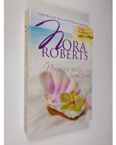 Kirjailijan Nora Roberts käytetty kirja Nyckeln till lycka