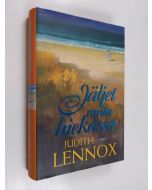 Kirjailijan Judith Lennox käytetty kirja Jäljet rantahiekassa