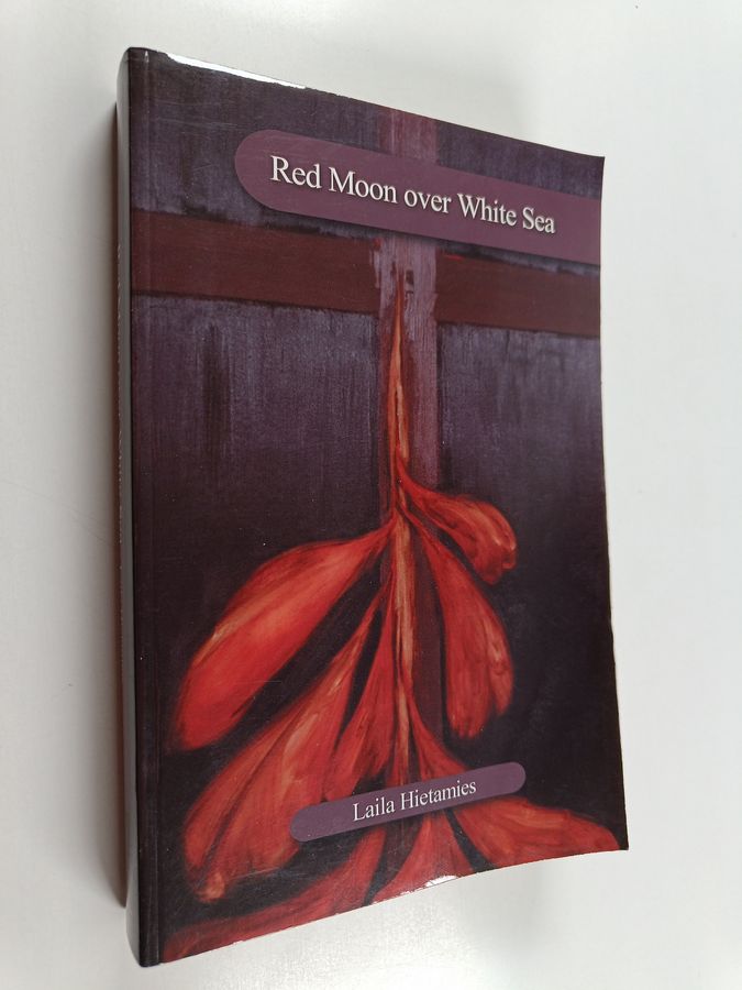 Red moon over white sea