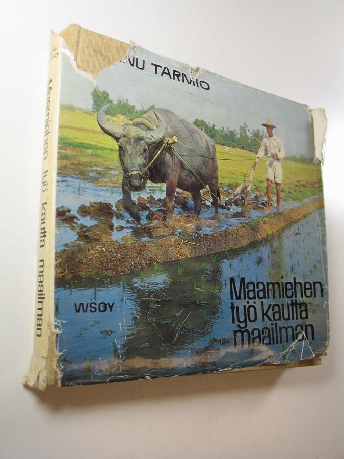 Hannu Tarmio : Maamiehen työ kautta maailman : kuvatarina maapallon pelloilta ja laitumilta